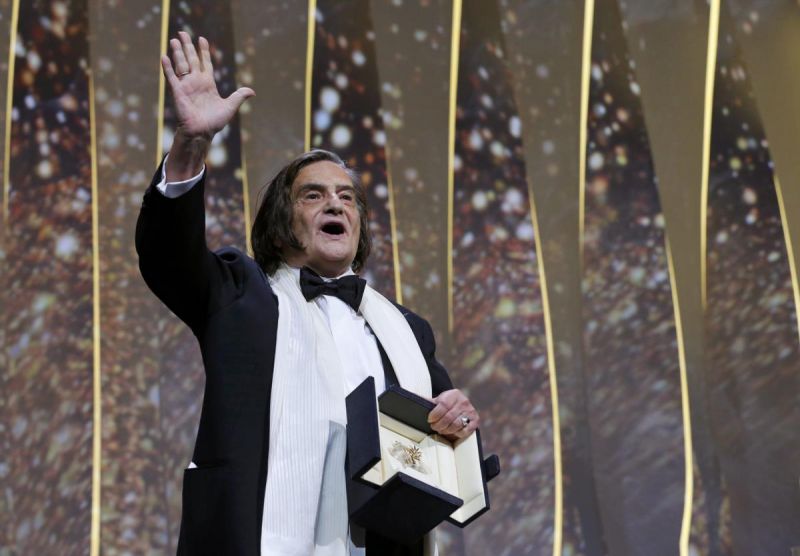 Jean-Pierre Leaud em palco depois de receber a Palma de Ouro honorária, num dos mais bonitos momentos da cerimónia de encerramento [Yves Herman / Reuters]