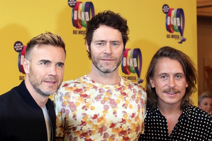 Gary Barlow, Howard Donald e Mark Owen, membros da banda Take That, em abril de 2019 © LUSA Gary Barlow, Howard Donald e Mark Owen, membros da banda Take That, em abril de 2019 © LUSA